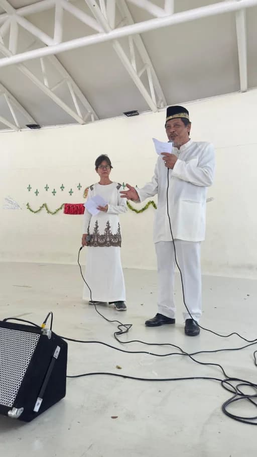 Residents speaking on stage during a THKMC community event.